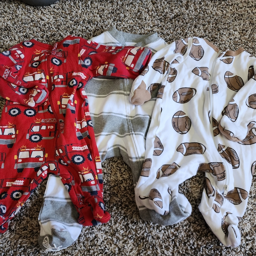 Three newborn onesies, One Burt's Bees